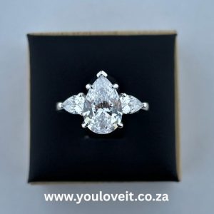 The Sterling Silver 3.00 ct. Pear Cut Trilogy Engagement Ring