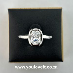 The Sterling Silver 1.00 ct. Radiant Cut 4 Prong Bezel Set Engagement Ring